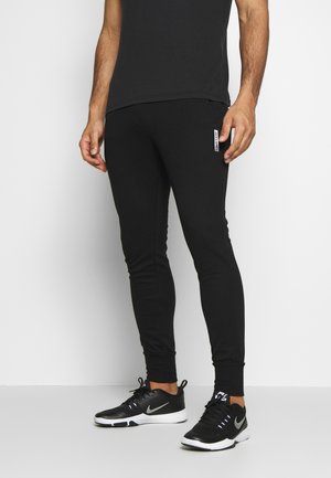 Jack & Jones Performance JJWILL PANTS - Pantalon de survêtement - black