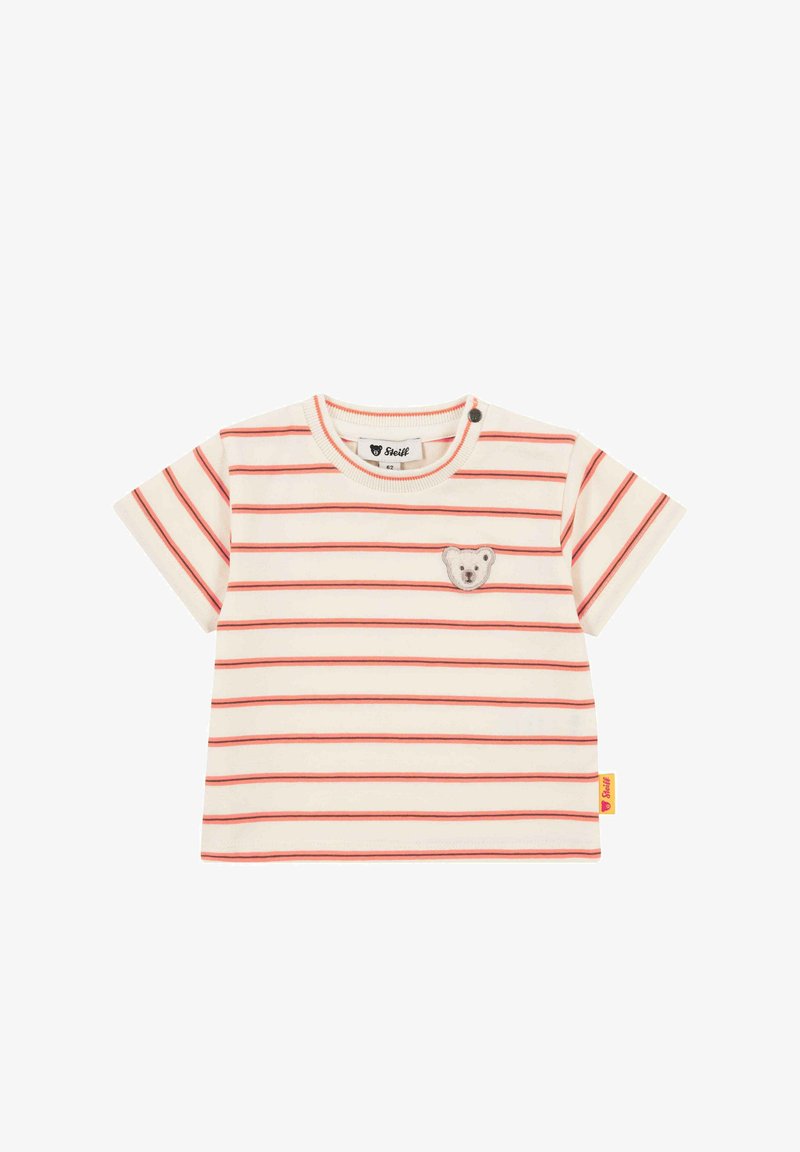 T-shirt à manches courtes rayé, crème et rouge, avec une broderie d'ours sur la poitrine et une étiquette de marque jaune sur le côté.