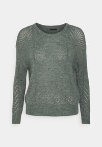 Ljusgrön stickad tröja med långa ärmar, rundad halsringning och mönstrad textur, med avslappnad passform och ribbad mudd och fåll.