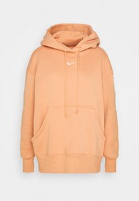Överdimensionerad peach hoodie med en fram- kangaroo ficka, vit logotyp broderi, dragsnören och ribbade manschetter och nederkant. Mjuk bomullsblandning.