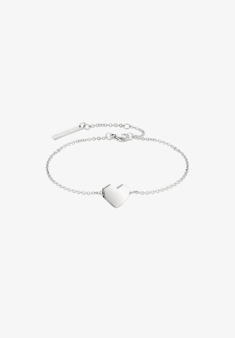 Silver chain bracelet featuring a heart-shaped charm with a polished finish and a small rectangular tag, adjustable length with a clasp.