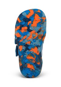 Sole of a multicolored sandal with blue, orange, and black marbled pattern and circular textured grips for traction.