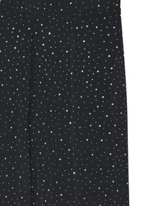 Black fabric featuring scattered silver sequins in various sizes, creating a shimmering, textured pattern across the surface.