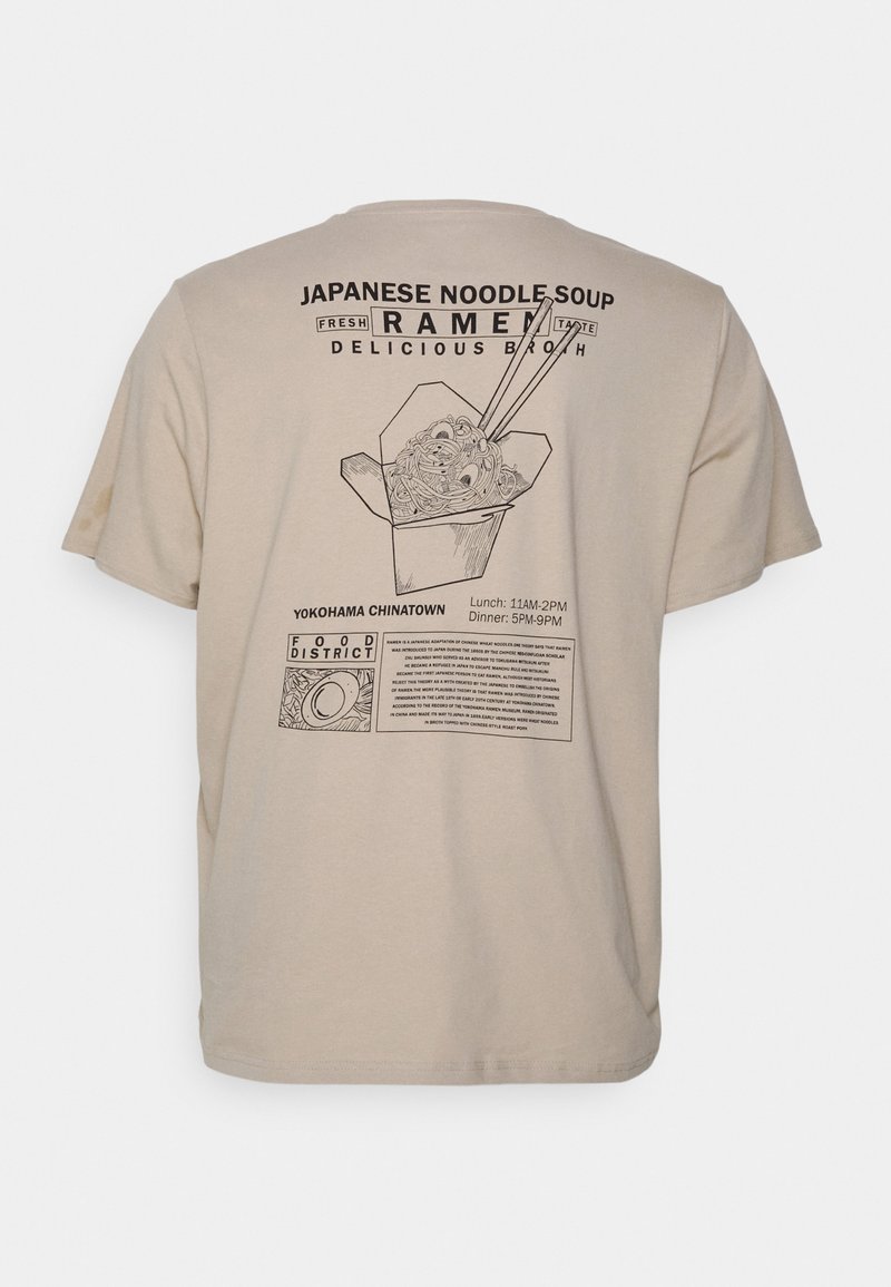 Beige t-shirt featuring a graphic print of ramen in a takeout box with chopsticks, accompanied by text for Yokohama Chinatown restaurant hours.