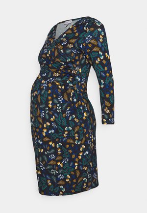 Vestido premamá de color azul oscuro con mangas largas y un estampado multicolor de flores y hojas en verde, amarillo, blanco y azul.