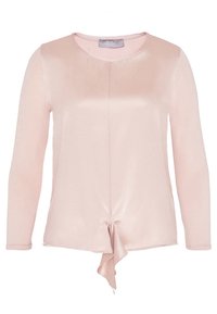 Ljusrosa långärmad topp med en slät, glansig textur, med rund halsringning och ett knyt detaljer vid midjan för extra design.