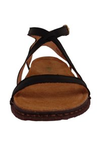 Sandalia de cuero negro con correas entrelazadas, plantilla de corcho y suela de goma marrón. Diseño simple y perfil plano para uso casual.