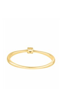 Bransoletka na rękę w odcieniu złota o zaokrąglonym, gładkim kształcie z małą ozdobną klamrą na górze. Minimalistyczny i elegancki wygląd.