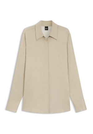 Long-sleeve beige shirt with hidden buttons, pointed collar, and cuffed sleeves, displayed flat against a white background.