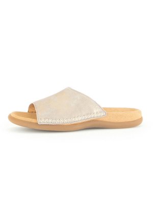 Beige slide sandal with a soft suede upper, open toe, stitched accent, and a cushioned tan footbed. Flat rubber sole for easy wear.