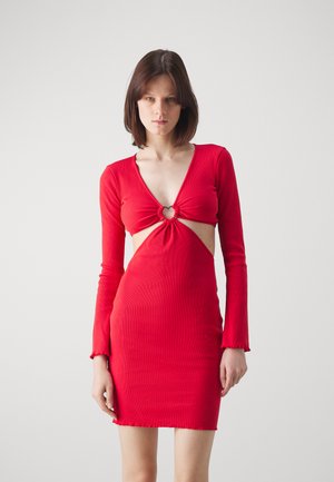Red ribbed dress with long sleeves, deep V-neck, heart-shaped cutout at the waist, and frayed hem. Lightweight fabric and fitted design.