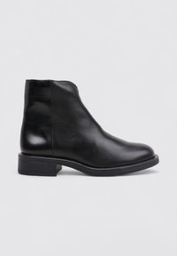 Black leather ankle boot with a smooth finish, tapered design, and low block heel. Features minimal stitching and a rounded toe.