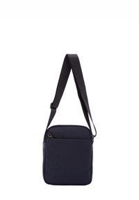 Borsa a tracolla blu navy realizzata in tessuto testurizzato, con un compartimento principale con zip, strap regolabile e una piccola tasca frontale.