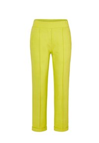 Limettengrüne Hosen mit glatter Textur, ausgestattet mit einem breiten elastischen Bund, zwei Fronttaschen und umgeschlagenen Bündchen.