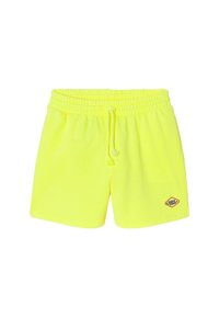 Shorts en jaune néon avec taille élastique et cordon de serrage, portant un petit patch "Sunset Club" sur la jambe gauche.