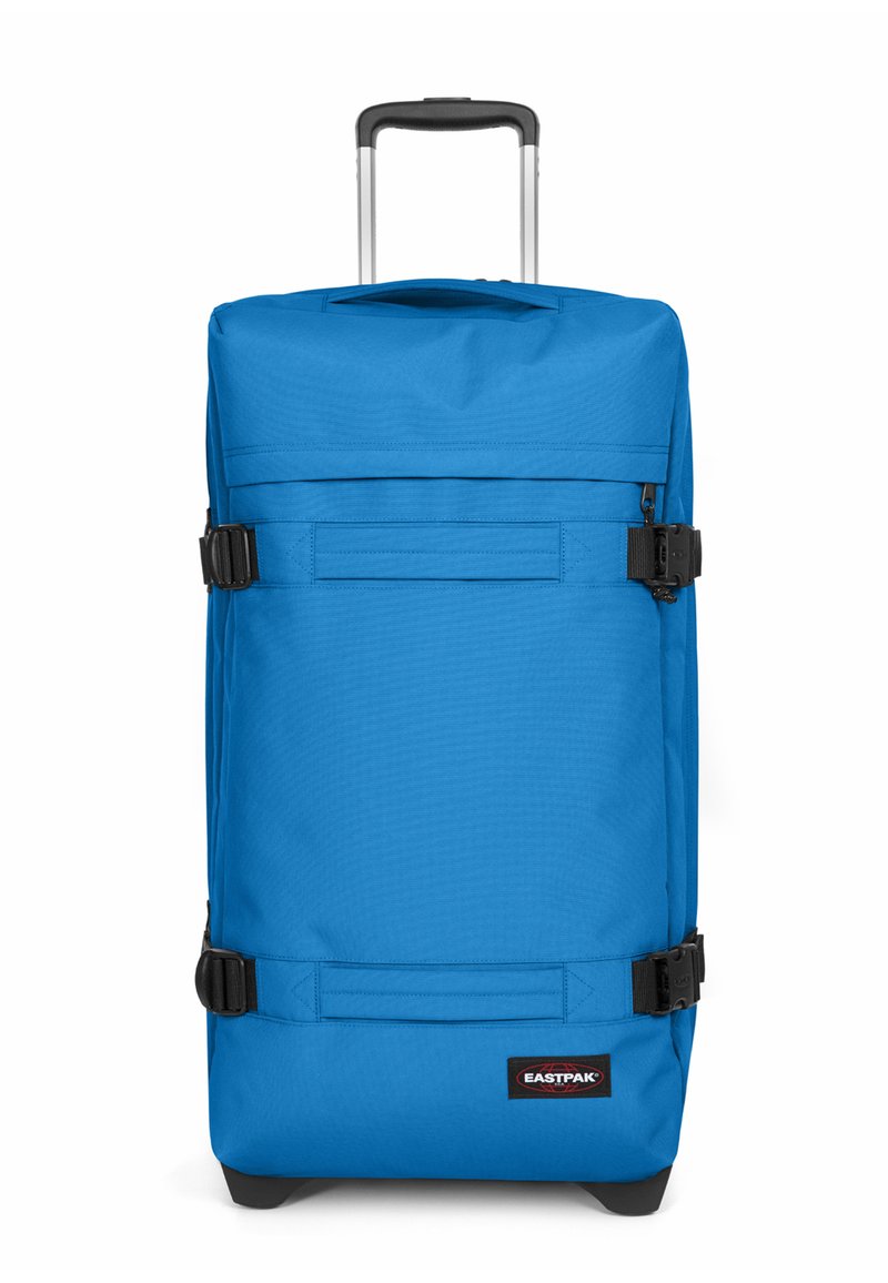 Blauer Rollkoffer aus strapazierfähigem Stoff, mit ausziehbarem Griff, verstellbaren Gurten und einem Logo am Boden.