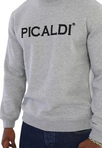 Gray sweatshirt featuring a large black embroidered "PICALDI" logo, made from a textured fabric with ribbed cuffs and hem.