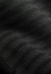 Black fabric with a smooth texture and fine-knit weave. The surface appears slightly shiny with consistent color throughout.