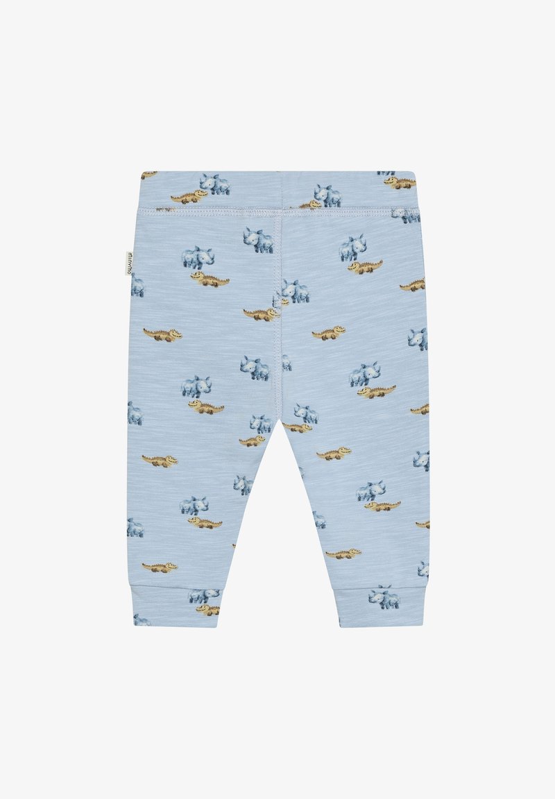 Leggings en coton bleu clair avec un motif ludique de dinosaures dessinés dans diverses couleurs, avec une texture douce et lisse.