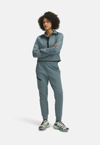 Under Armour UNSTOPPABLE FLEECE - Tepláky - jasper blue