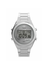 Montre numérique Timex Q80 avec un boîtier et un bracelet en acier inoxydable argenté, grand écran LCD, boutons marqués et fonction 'Indiglo'.