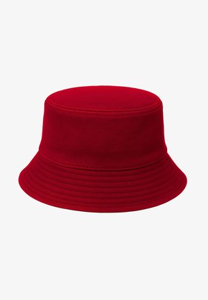 Chapeau bob rouge en tissu tissé, avec une calotte ronde et un large bord souple. Texturé avec des lignes horizontales et une finition lisse.