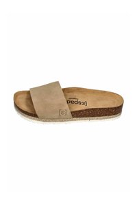 Beige suede slide sandal with cork footbed, thick strap, and textured rubber sole. Minimalistic design with a natural finish.