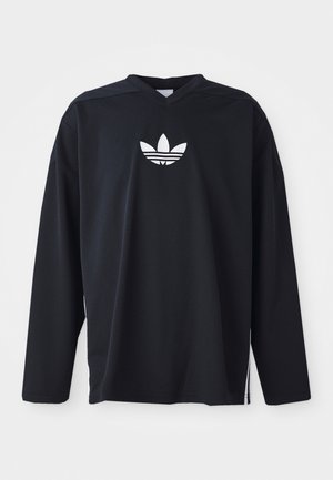 Black long-sleeve jersey made of mesh fabric, featuring a V-neck and white Adidas trefoil logo at the chest. Side slits at the hem.