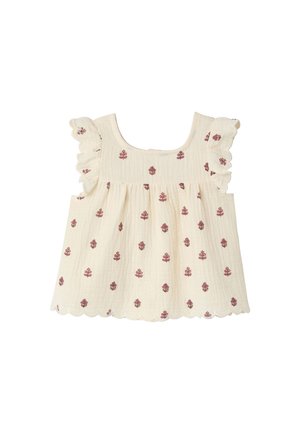 Cream sleeveless toddler top with ruffled shoulders, scalloped hem, and small red floral prints scattered throughout.