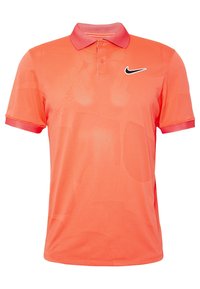 Orange polo shirt med et struktureret mønster, krave og korte ærmer. Har et lille sort Nike-logo på venstre bryst.