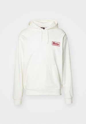 White hooded sweatshirt made of soft fabric. Features a front pocket and a red embroidered logo patch. Cuffs and hem are ribbed.