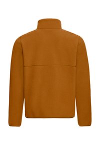 Veste en polaire orange-brun chaud, avec un col montant et une texture lisse. Détail de couture remarquable sur le dos.