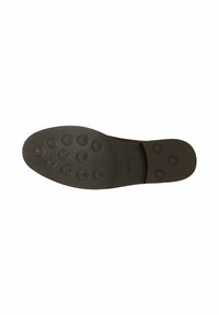 Semelle d’une chaussure habillée marron foncé avec des clous ronds en caoutchouc au talon et à l’avant-pied pour l’adhérence et la durabilité.