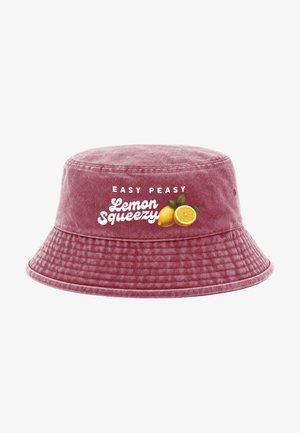 Red bucket hat with white text "Easy Peasy Lemon Squeezy" and an illustration of a whole and a sliced lemon with green leaves.