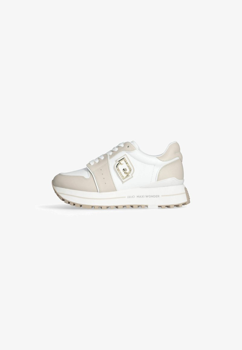 White and beige sneaker with a textured leather upper, featuring a decorative buckle, padded collar, and a thick, rugged sole.