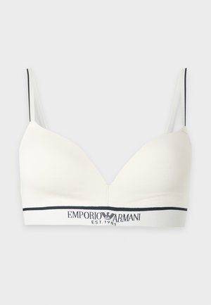 Bralette bianco con coppe a triangolo, spalline sottili regolabili e fascia nera con logo e testo Emporio Armani "EST. 1981" sotto le coppe.