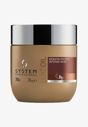 Gouden pot van System Professional Luxe Oil Keratin Protect Intense Mask, 200 ml. Glad metalen zwart deksel, rode en witte label met productdetails.