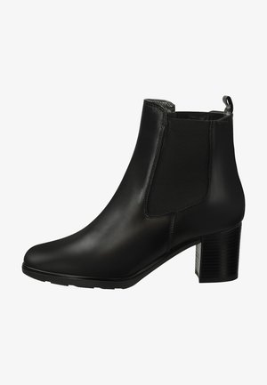 Schwarze Leder-Ankle Boots mit runder Zehenpartie, elastischen Seiteneinsätzen und einem strukturierten Blockabsatz. Glatte Oberfläche mit minimalen Akzenten.