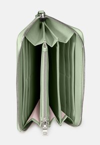 Green leather wallet with multiple compartments, a zip closure, and a light pink interior lining. Smooth texture and rectangular shape.