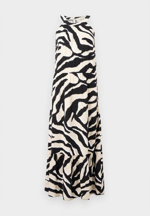 Robe longue à bretelles halter en tissu léger, présentant un motif zèbre noir et crème avec un ourlet à volants en couches.
