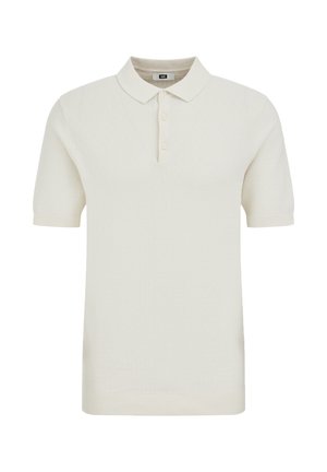 Polo tričko s krátkym rukávom v svetlo krémovej farbe, textúrovaná látka, vybavené klasickým golierom, zapínaním na tri gombíky a rebrovanými manžetami.