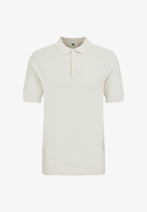 Rövid ujjú, világos krémszínű póló, texturált anyagból, klasszikus gallérral, háromgombos záródással és bordás mandzsettákkal.
