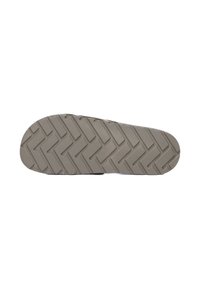 Kumipohja vaaleanharmaana, herringbone-kuviolla ja tekstuuripinnalla, joka tarjoaa pitoa. Pyöristetty varvasosa ja litteä muoto.