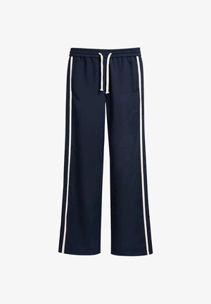 Pantalon de survêtement bleu marine à jambes larges avec des bandes blanches sur les côtés, taille élastique et cordon blanc, doté de poches avant.