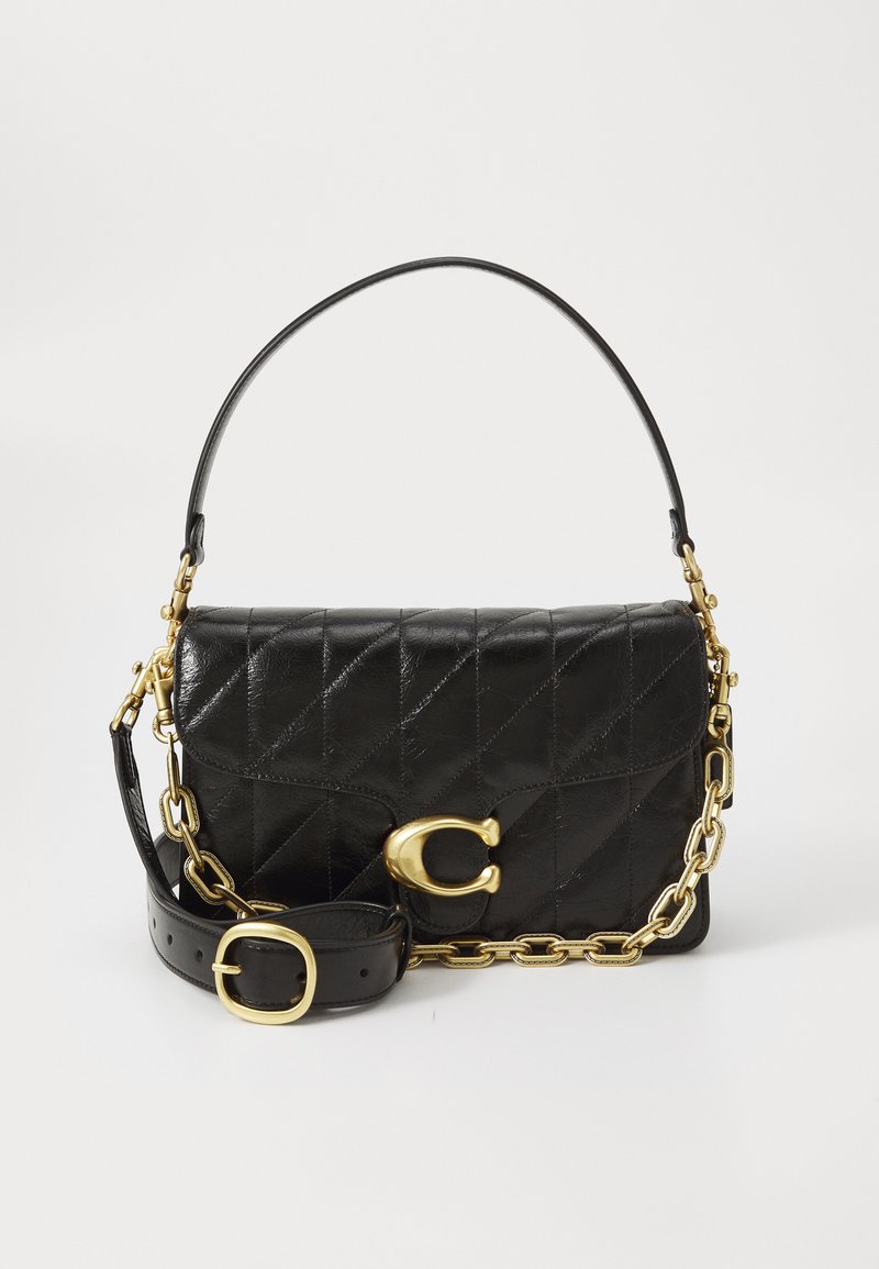 Black leather handbag with quilted design, a gold chain strap, and a prominent gold clasp. Features a detachable leather strap for versatility.