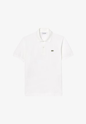 Witte polo shirt van katoen, met een klassieke kraag, korte mouwen en een klein groen Lacoste krokodillenlogo op de linkerborst.