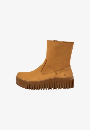 Tan suede ankle boot with side elastic openings and a textured platform sole. Features visible stitching and a logo accent near the heel.