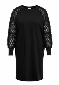 Svart kjole med ribbet halslinning og lange, gjennomsiktige ermer med volanger. Mykt stoff med rett snitt og sidespalter nederst.