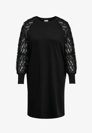 Vestido negro con escote acanalado y mangas largas, transparentes y con volantes. Tela suave con corte recto y aberturas laterales en el dobladillo.