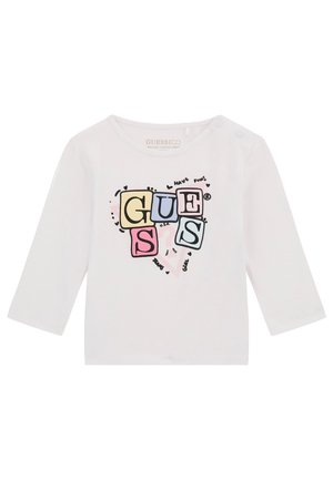 T-shirt à manches longues blanche en coton biologique avec un design de logo coloré en lettres majuscules et des accents ludiques sur le devant.